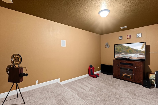 408 Egret Place Dr, Winter Garden, FL 34787 - cinema room featuring carpet floors, baseboards, and a textured ceiling