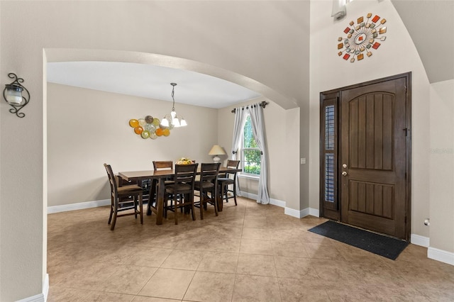 408 Egret Place Dr, Winter Garden, FL 34787 - foyer entrance featuring arched walkways, baseboards, a chandelier, and light tile patterned floors
