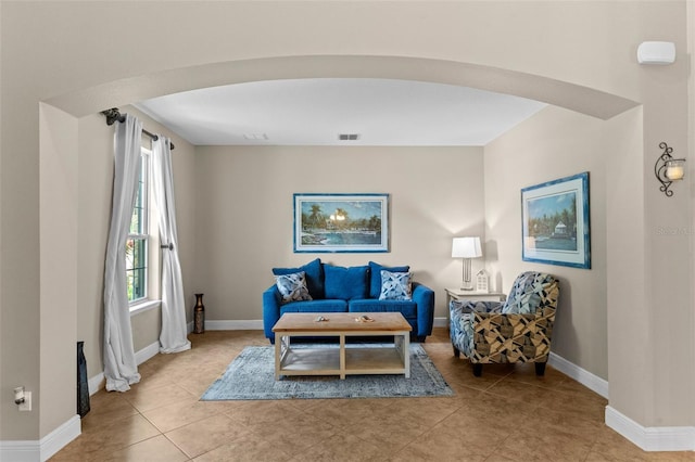 408 Egret Place Dr, Winter Garden, FL 34787 - tiled living area with arched walkways and baseboards