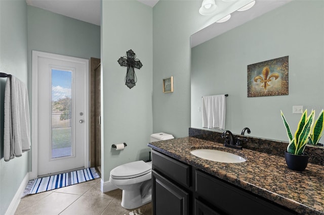 408 Egret Place Dr, Winter Garden, FL 34787 - bathroom with baseboards, tile patterned floors, vanity, toilet, and a shower