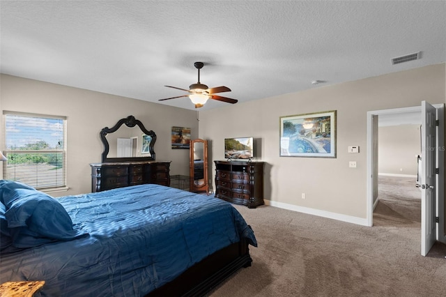408 Egret Place Dr, Winter Garden, FL 34787 - bedroom featuring carpet flooring, a textured ceiling, baseboards, and a ceiling fan