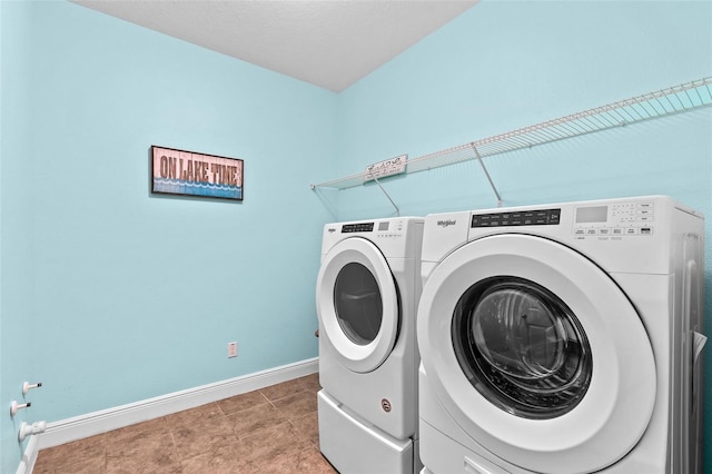 408 Egret Place Dr, Winter Garden, FL 34787 - laundry room with washer and clothes dryer and baseboards