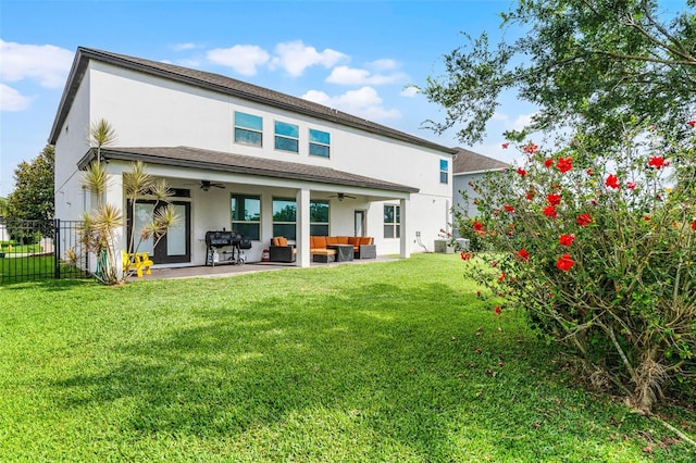 408 Egret Place Dr, Winter Garden, FL 34787 - rear view of house with ceiling fan, an outdoor living space, stucco siding, and a patio area