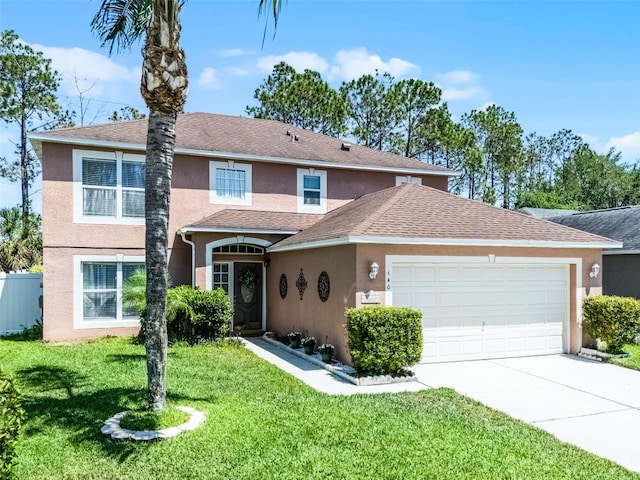 traditional-style home with roof with shingles, a front lawn, concrete driveway, an attached garage, and stucco siding
