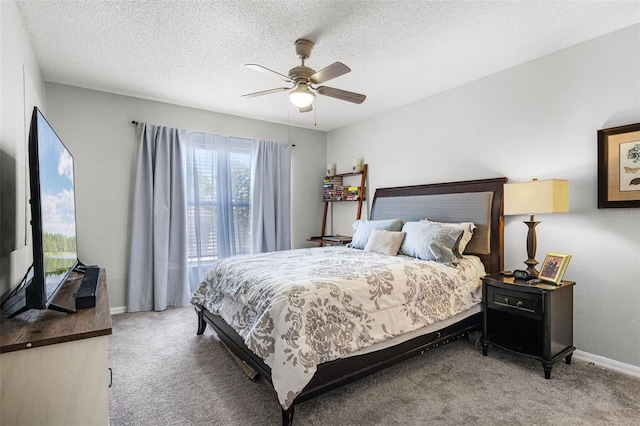 bedroom featuring carpet floors, a textured ceiling, ceiling fan, and baseboards