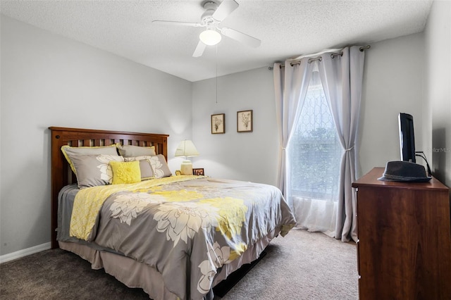 bedroom featuring carpet floors, a ceiling fan, and a textured ceiling