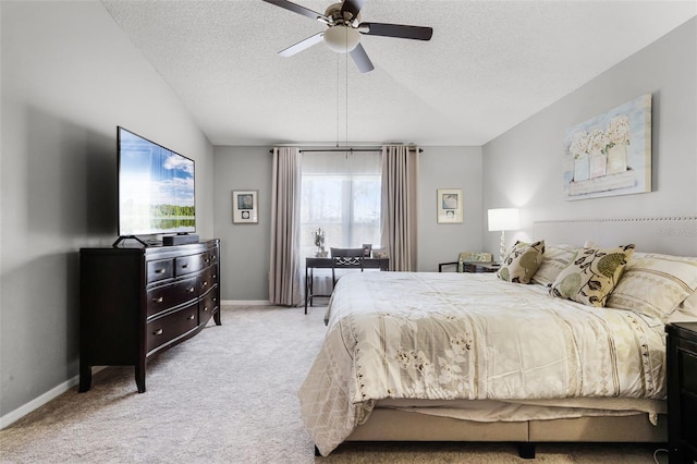 carpeted bedroom featuring baseboards, a ceiling fan, a textured ceiling, and lofted ceiling