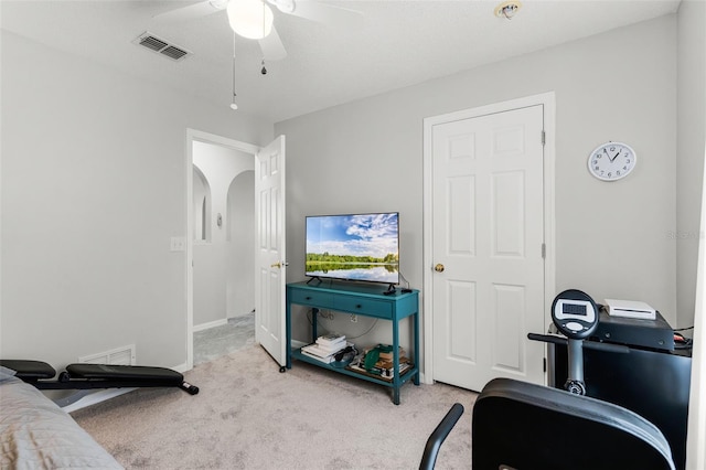 interior space featuring ceiling fan and visible vents