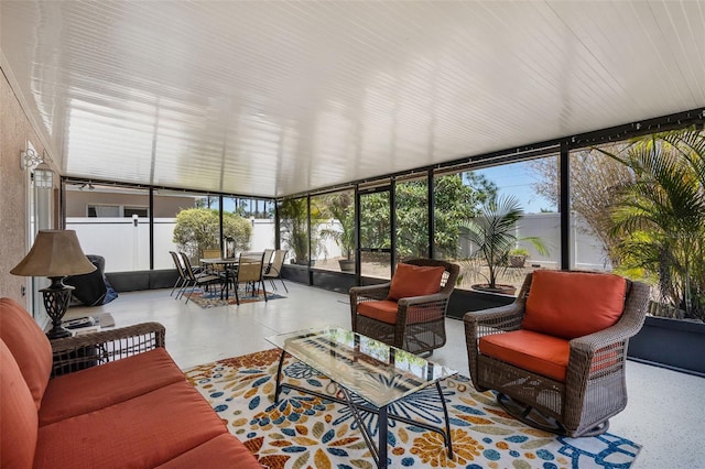 sunroom / solarium featuring a wall of windows and a healthy amount of sunlight