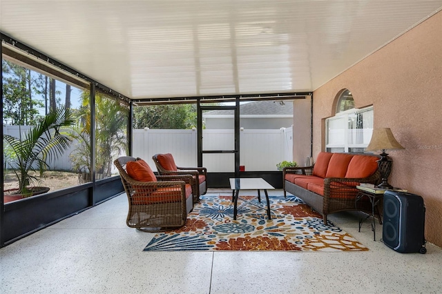 sunroom featuring an outdoor hangout area