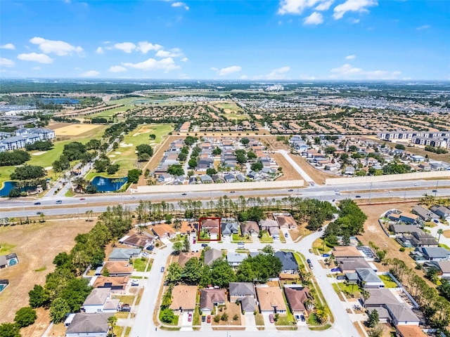 drone / aerial view featuring a water view and a residential view