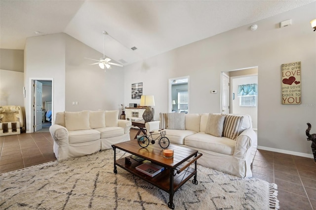 living room with tile patterned flooring, high vaulted ceiling, a ceiling fan, baseboards, and visible vents