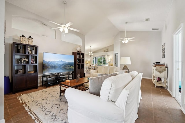 tiled living room with high vaulted ceiling, visible vents, baseboards, and ceiling fan with notable chandelier