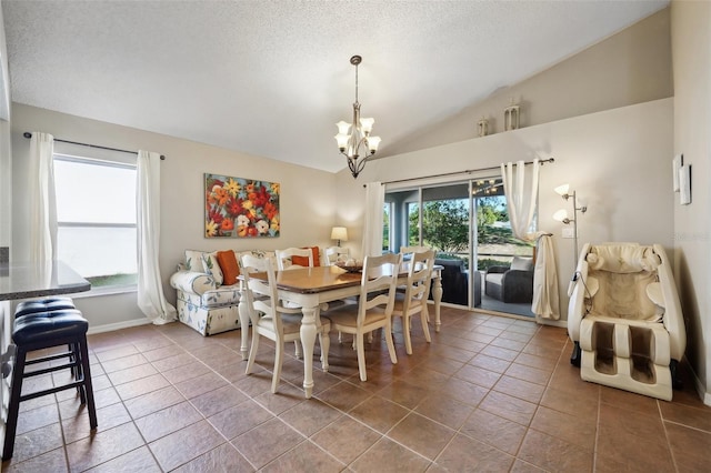 tiled dining area featuring baseboards, vaulted ceiling, a textured ceiling, and a chandelier