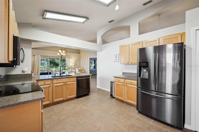 kitchen featuring visible vents, an inviting chandelier, dark countertops, a sink, and black appliances