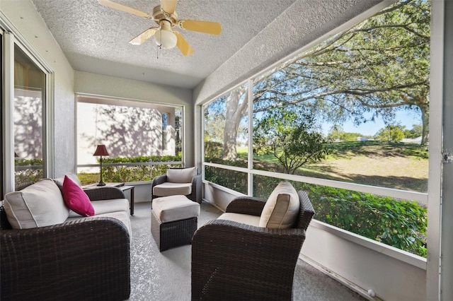 sunroom / solarium with a ceiling fan and an outdoor hangout area