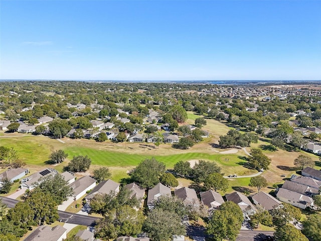 bird's eye view with view of golf course and a residential view
