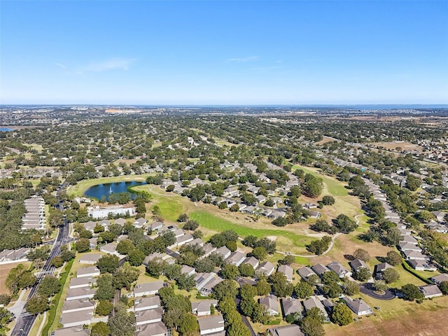 aerial view featuring a residential view, a water view, and golf course view