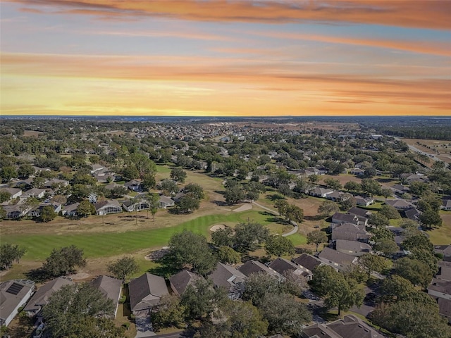 birds eye view of property with a residential view and view of golf course