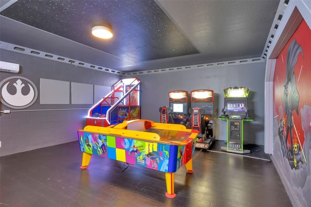7643 Wilmington Loop, Kissimmee, FL 34747 - recreation room with hardwood / wood-style flooring and a wall unit AC