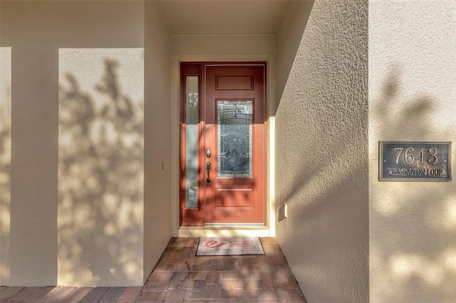 7643 Wilmington Loop, Kissimmee, FL 34747 - view of exterior entry with stucco siding