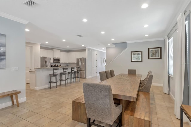 7643 Wilmington Loop, Kissimmee, FL 34747 - dining area with light tile patterned floors, recessed lighting, ornamental molding, and visible vents