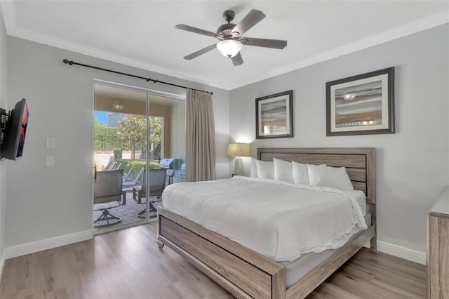 7643 Wilmington Loop, Kissimmee, FL 34747 - bedroom featuring wood finished floors, baseboards, access to exterior, and ornamental molding