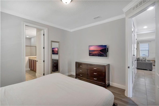 7643 Wilmington Loop, Kissimmee, FL 34747 - bedroom featuring baseboards, ornamental molding, light wood finished floors, and visible vents