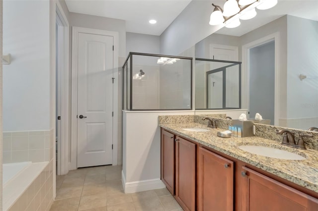 7643 Wilmington Loop, Kissimmee, FL 34747 - full bathroom featuring a shower stall, tile patterned flooring, double vanity, and a sink