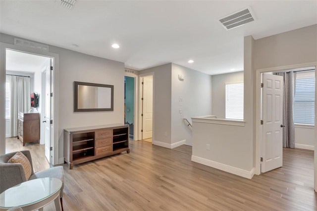 7643 Wilmington Loop, Kissimmee, FL 34747 - living room featuring light wood-type flooring, visible vents, baseboards, and recessed lighting
