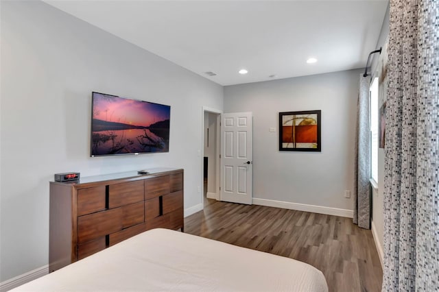 7643 Wilmington Loop, Kissimmee, FL 34747 - bedroom featuring recessed lighting, baseboards, visible vents, and wood finished floors