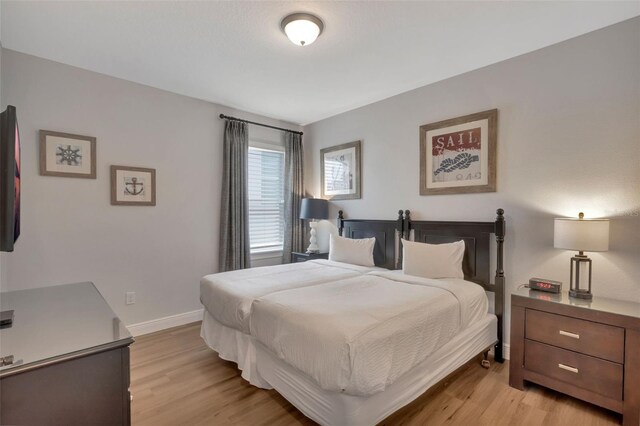 7643 Wilmington Loop, Kissimmee, FL 34747 - bedroom with light wood-style floors and baseboards