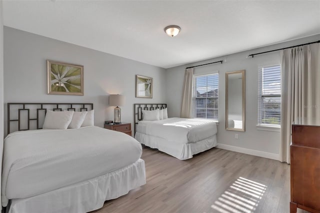 7643 Wilmington Loop, Kissimmee, FL 34747 - bedroom with baseboards and wood finished floors