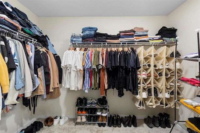 spacious closet featuring carpet floors