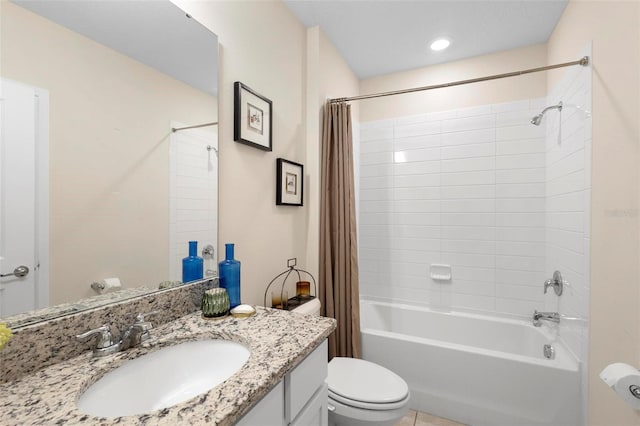 bathroom featuring vanity, toilet, and shower / bath combo