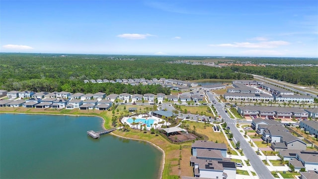 birds eye view of property featuring a water view, a residential view, and a view of trees