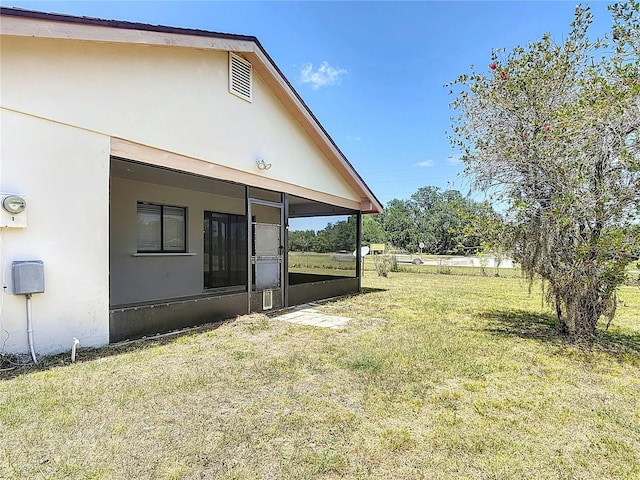 857 E Flag Ln, Kissimmee, FL 34759 - view of yard featuring a sunroom