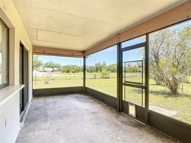 857 E Flag Ln, Kissimmee, FL 34759 - unfurnished sunroom featuring a healthy amount of sunlight