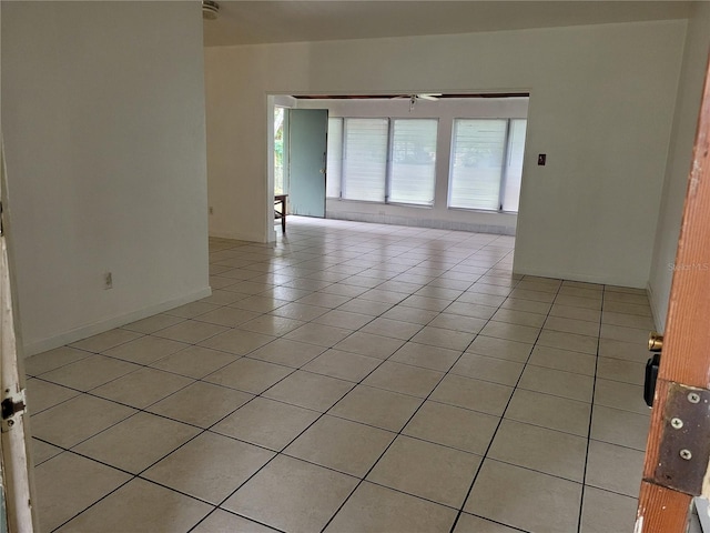 936 Pinedale Ave, Orlando, FL 32808 - unfurnished room with light tile patterned floors and baseboards