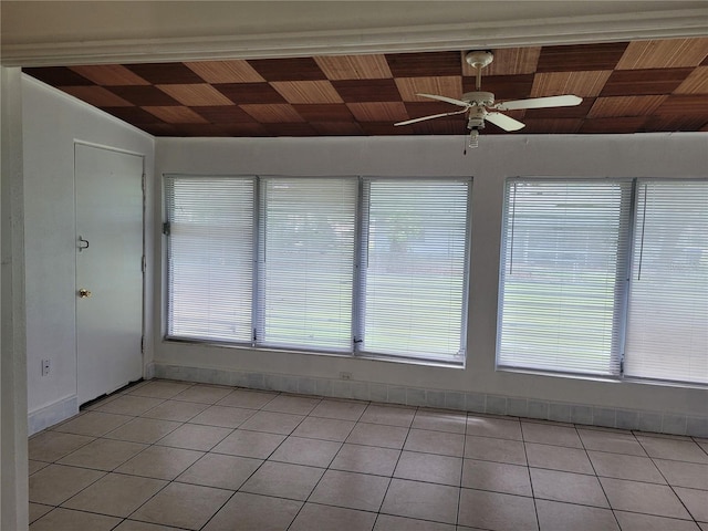 936 Pinedale Ave, Orlando, FL 32808 - interior space with light tile patterned floors, baseboards, a ceiling fan, and wood ceiling