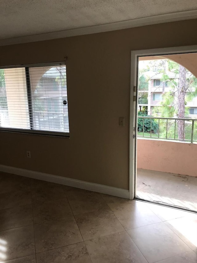 133 Oyster Bay Cir Unit 330, Altamonte Springs, FL 32701 - empty room featuring baseboards, tile patterned flooring, and a textured ceiling