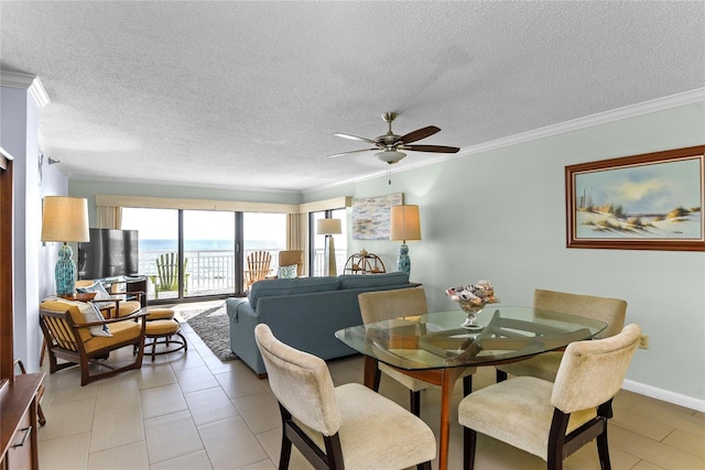 5301 S Atlantic Ave Unit 51, New Smyrna Beach, FL 32169 - dining room with crown molding, a textured ceiling, and ceiling fan