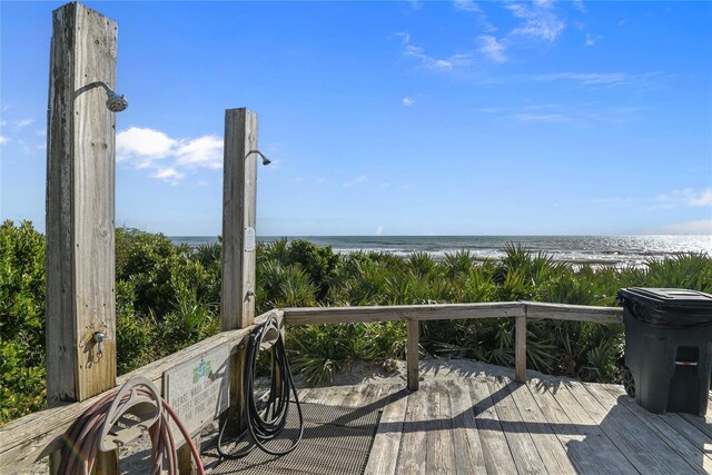 5301 S Atlantic Ave Unit 51, New Smyrna Beach, FL 32169 - wooden terrace featuring a beach view and a water view