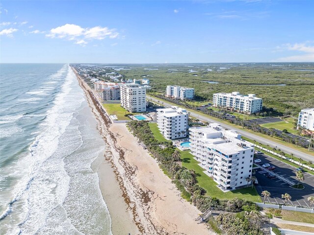 5301 S Atlantic Ave Unit 51, New Smyrna Beach, FL 32169 - drone / aerial view featuring a view of the beach and a water view