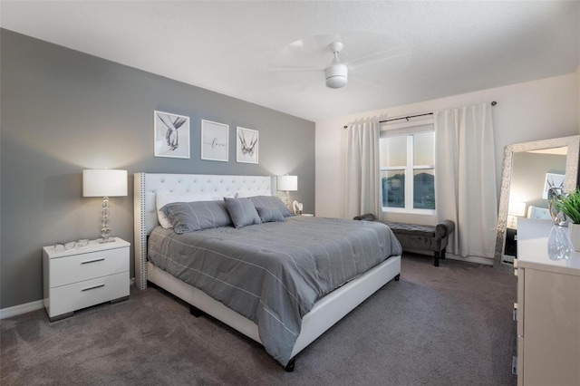 555 Meadow Bend Dr, Davenport, FL 33837 - bedroom with dark colored carpet, ceiling fan, and baseboards