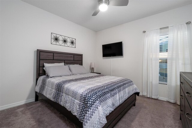 555 Meadow Bend Dr, Davenport, FL 33837 - carpeted bedroom featuring baseboards and a ceiling fan