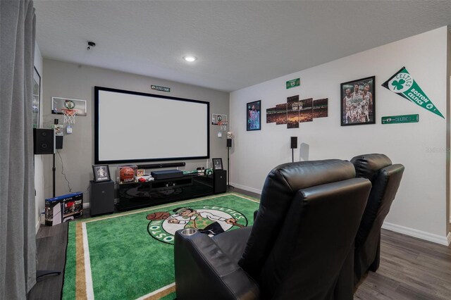 555 Meadow Bend Dr, Davenport, FL 33837 - home theater featuring wood finished floors, baseboards, recessed lighting, and a textured ceiling
