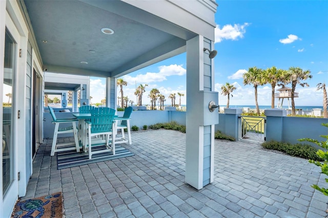 7 Marden Dr, Ormond Beach, FL 32176 - view of patio with a gate, outdoor dining space, a water view, and fence