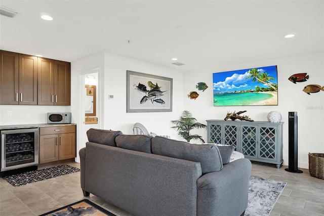 7 Marden Dr, Ormond Beach, FL 32176 - living area featuring beverage cooler, a bar, and recessed lighting