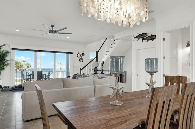 7 Marden Dr, Ormond Beach, FL 32176 - dining area featuring stairway, a ceiling fan, crown molding, light tile patterned flooring, and a water view